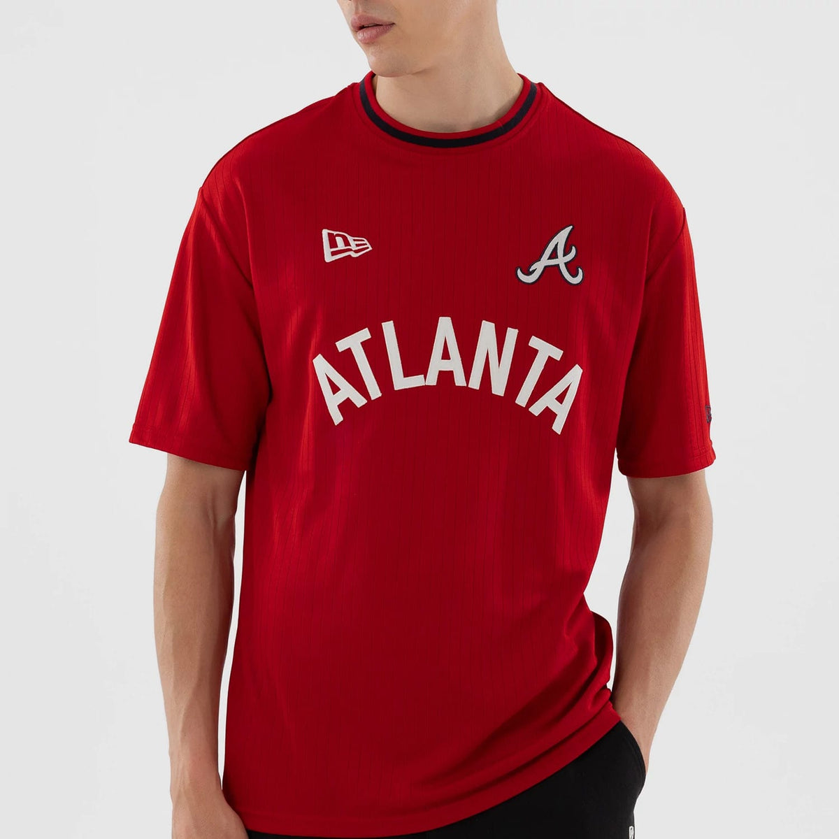 The model is wearing this MLB Atlanta Braves Oversized T-Shirt in red. 5