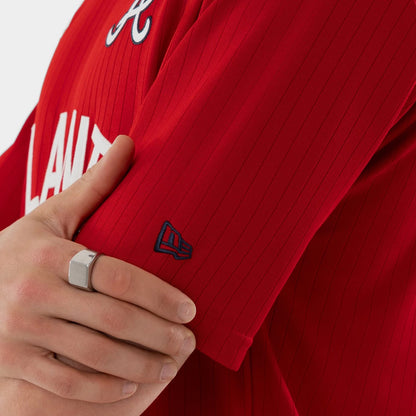The model is wearing this MLB Atlanta Braves Oversized T-Shirt in red. 6