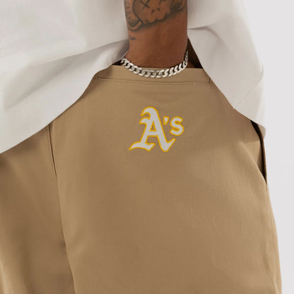 The model is wearing this MLB Athletics Chino Trousers in light beige. 3