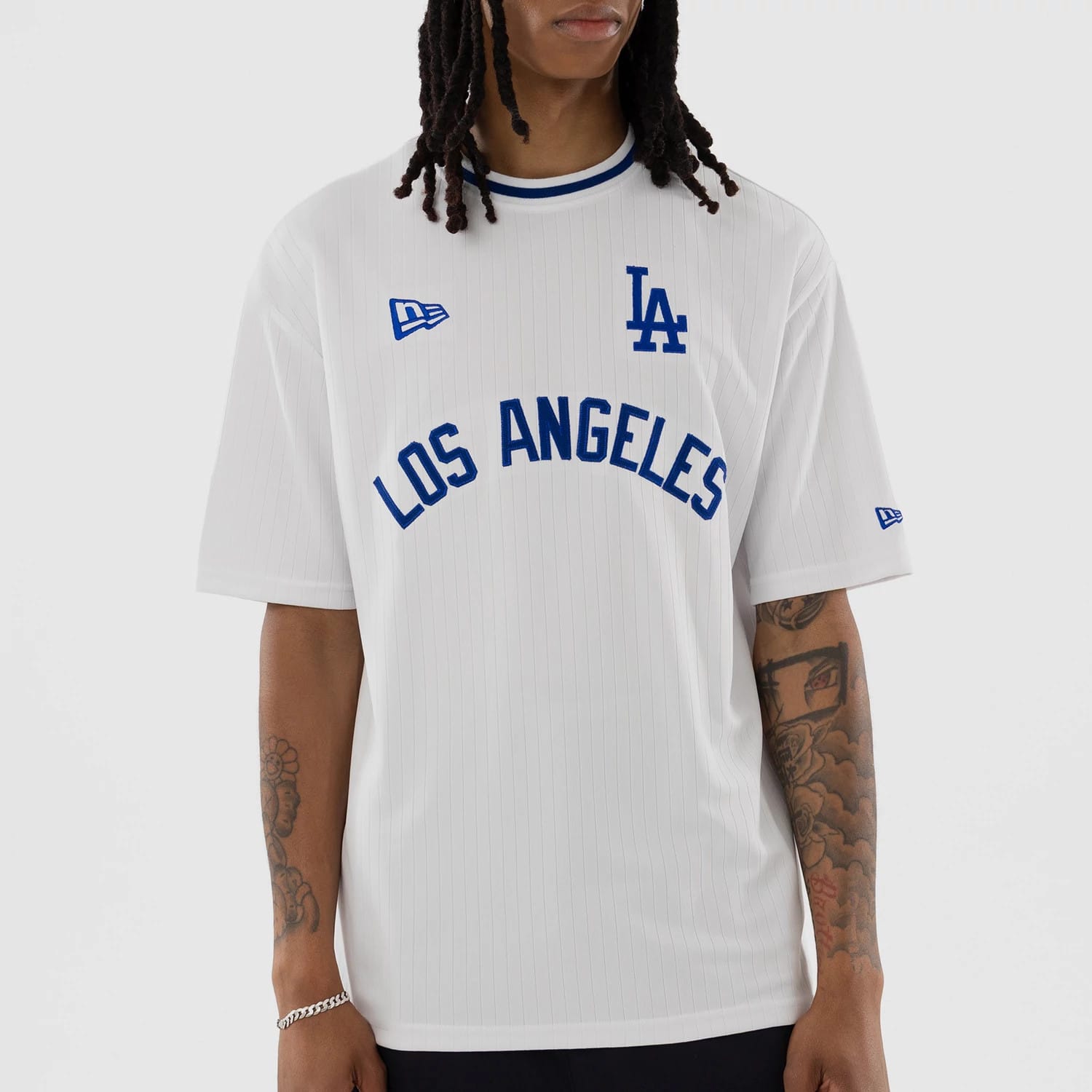 The model is wearing this MLB LA Dodgers Oversized T-Shirt in white. 4