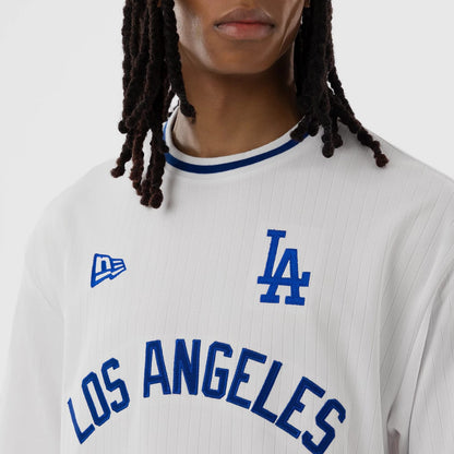 The model is wearing this MLB LA Dodgers Oversized T-Shirt in white. 3