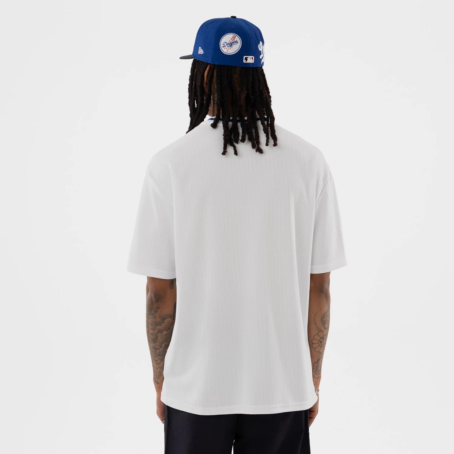 The model is wearing this MLB LA Dodgers Oversized T-Shirt in white. 2
