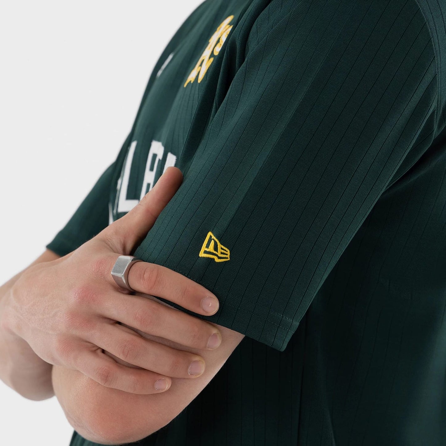 The model is wearing this MLB Athletics Oversized T-Shirt in dark green. 6