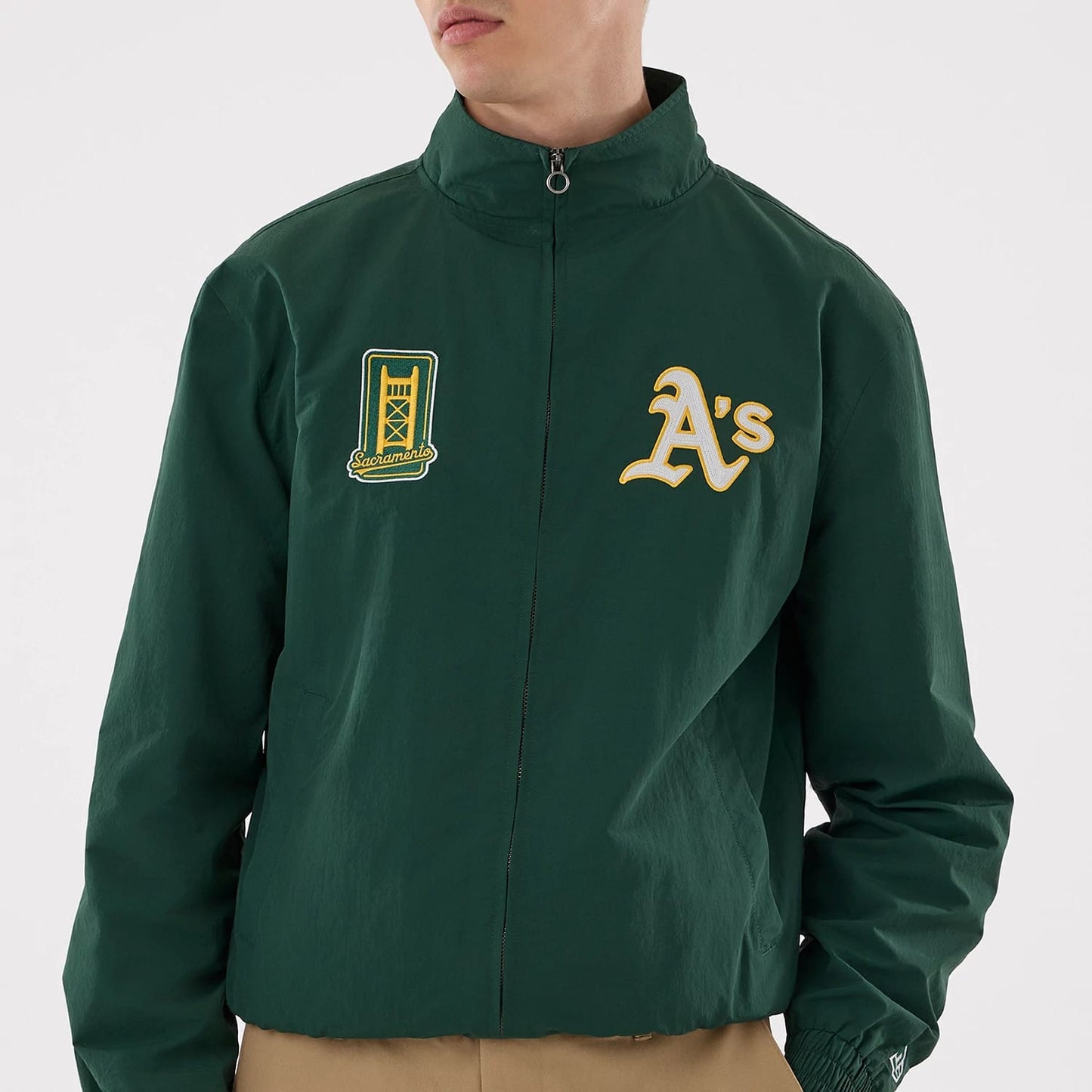 The model is wearing this MLB Athletics Sports Jacket in dark green. 3