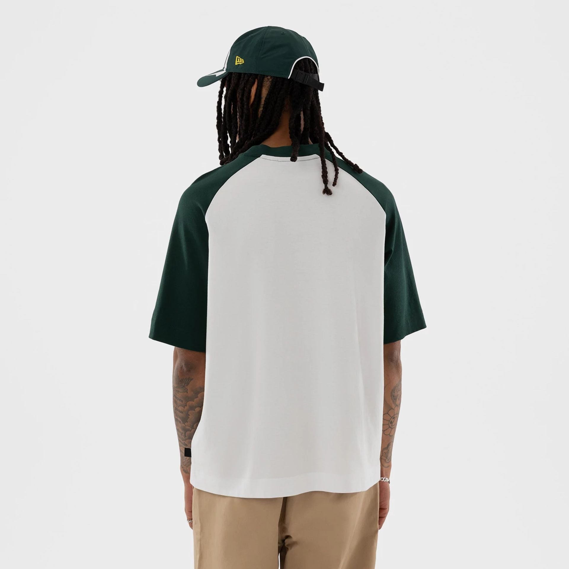 The model is wearing this MLB Athletics Boxy T-Shirt in white. 2