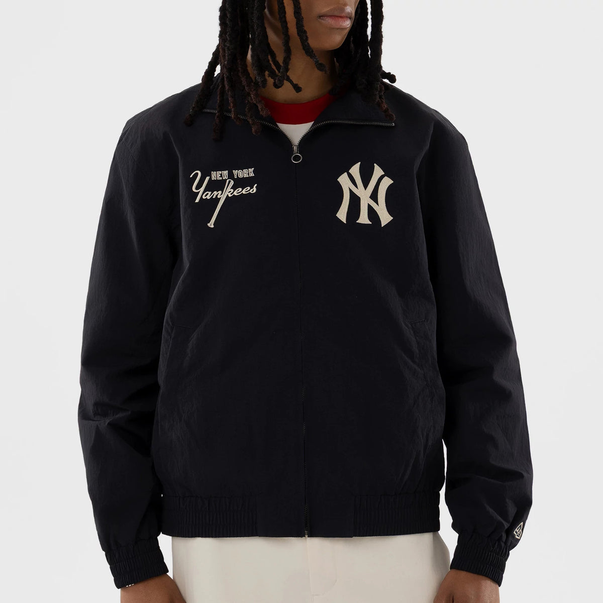 New Era New York Yankees MLB Navy Sports Jacket, front view on-model displaying the large white embroidered Yankees logo on the left chest, additional New York Yankees script logo embroidered on the right side.