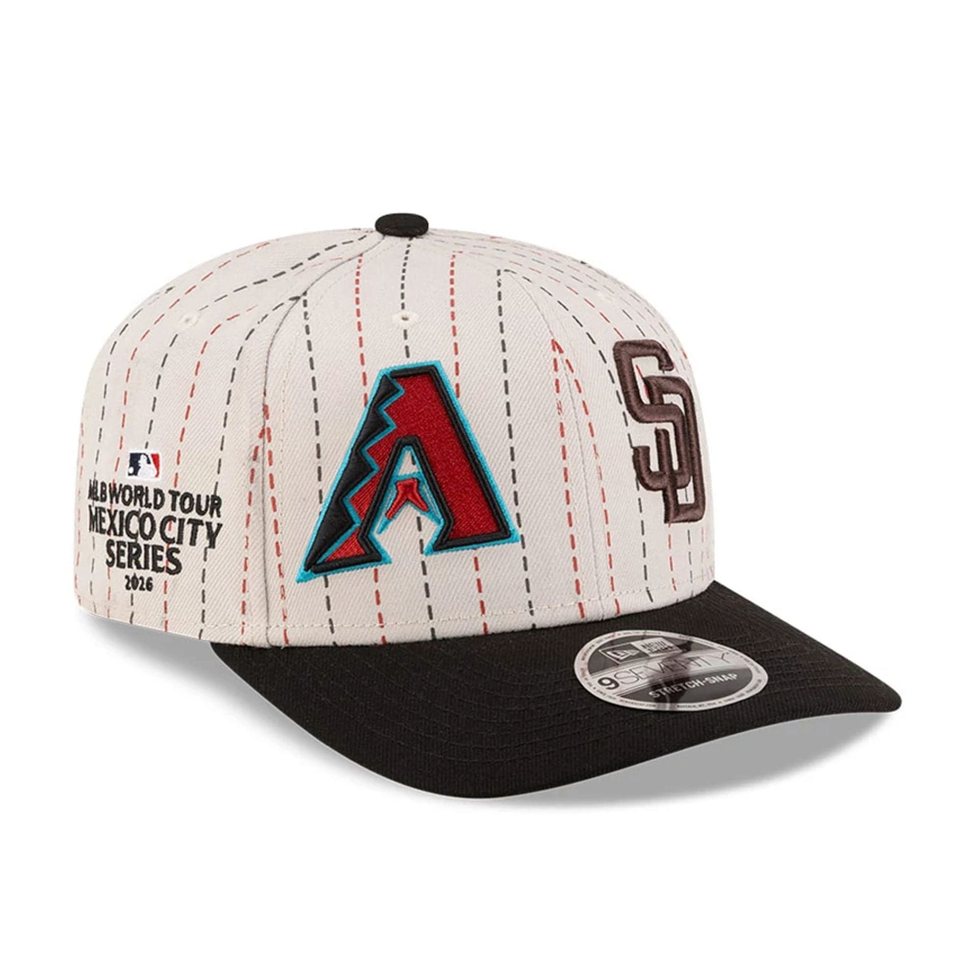 Pictured is this MLB Mexico City Series 2026 MLB Dueling League Logos 9SEVENTY Stretch Snap Adjustable cap in light beige. 1