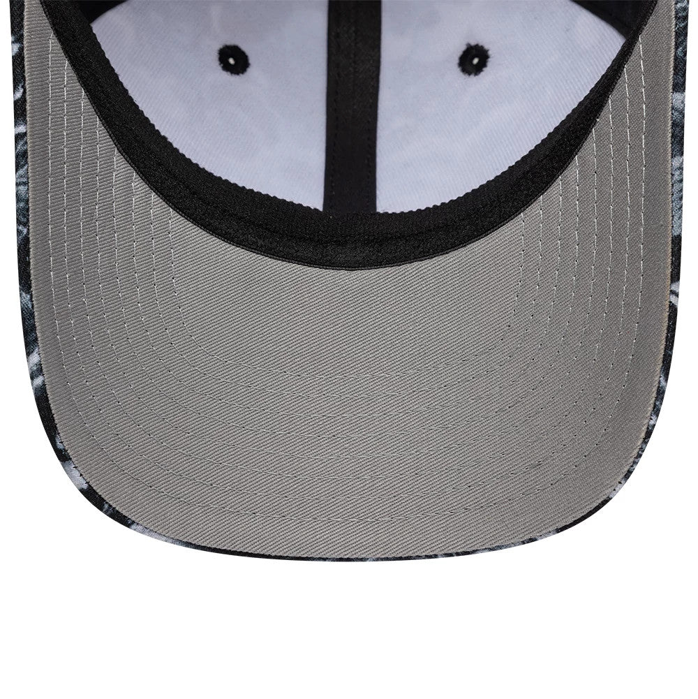New Era Floral Black 39SEVENTY Stretch Fit Cap, inside view showing a grey undervisor and black inner taping against a white and black floral patterned crown, highlighting the detailed stitching along the edges of the visor.