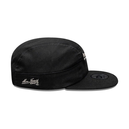 Pictured is this New Era X Hermanos Koumori Running Camper cap in black. 4