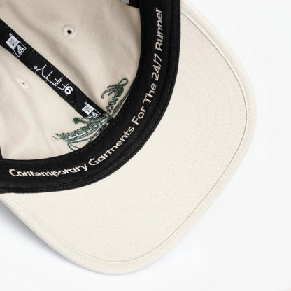 Pictured is this New Era X Hermanos Koumori Cursive Retro Crown 9FIFTY cap in Cream. 4
