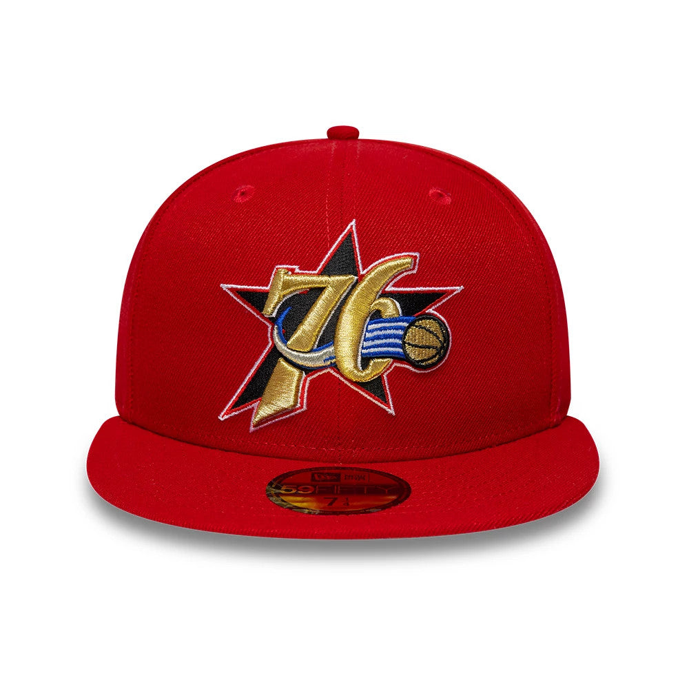 Philadelphia 76ers NBA Hardwood Classic Red New Era 59FIFTY Fitted Cap, front view showing a raised gold and black embroidered 76ers logo with a red star behind it on the red front panel, with a flat red visor and gold 59FIFTY size sticker.
