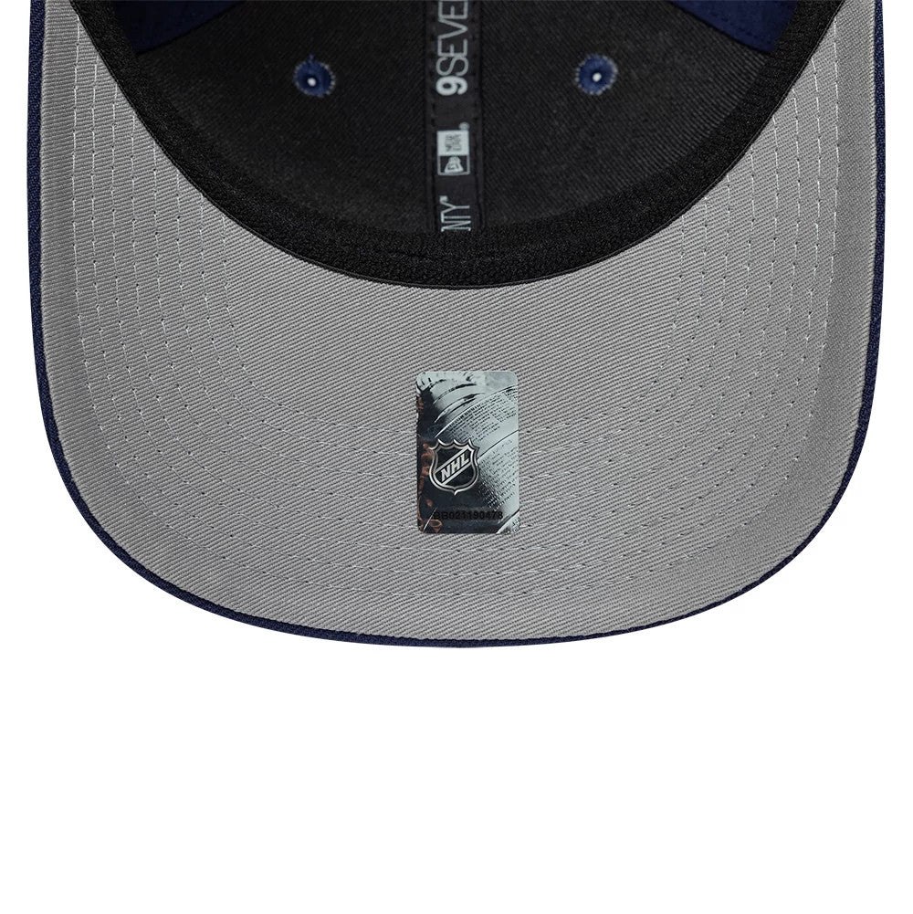 Toronto Maple Leafs NHL Team Navy New Era 9SEVENTY Stretch Snap Adjustable Cap, inside view showing the grey undervisor with an NHL sticker, black sweatband, and dark taping embroidered with the 9SEVENTY and New Era logos in white.