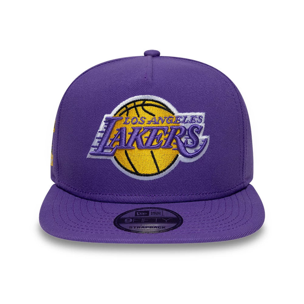 LA Lakers NBA Hardwood Classic Purple New Era 9FIFTY A-Frame Snapback Adjustable Cap, front view showing the raised yellow and purple embroidered Lakers logo on the structured purple crown, with a black 9FIFTY size sticker on the flat visor.