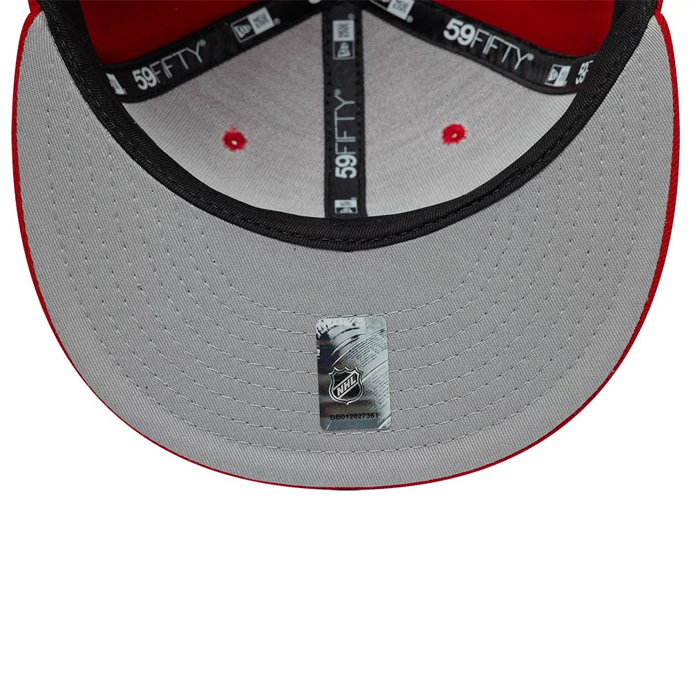 Chicago Blackhawks NHL Basic Red New Era 59FIFTY Fitted Cap, inside view showing the black internal taping with white 59FIFTY logos, a grey undervisor with an NHL sticker at the centre, and red-panel lining with black edging.