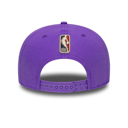 Pictured is this NBA Hardwood Classic Toronto Raptors 9FIFTY A-Frame Snapback cap in bright purple. 6