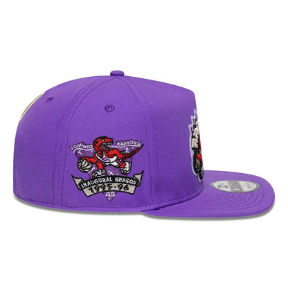 Pictured is this NBA Hardwood Classic Toronto Raptors 9FIFTY A-Frame Snapback cap in bright purple. 5