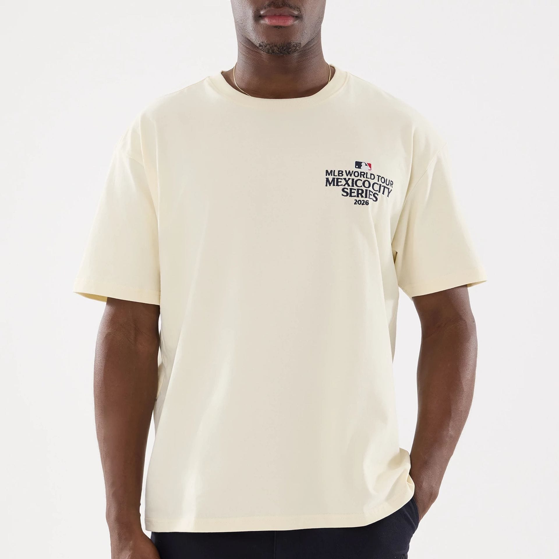 The model is wearing this MLB Mexico City Series 2026 Dueling Logo T-Shirt in Cream. 5