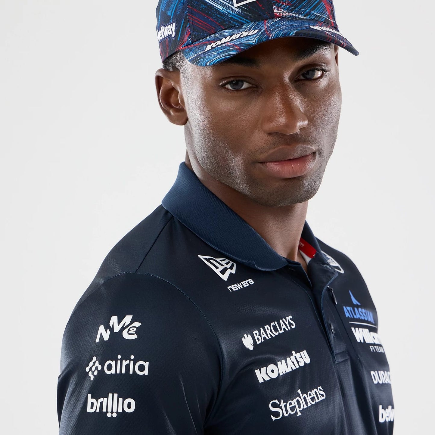 The model is wearing this Williams GB Race Special Tech Polo T-Shirt in navy. 5