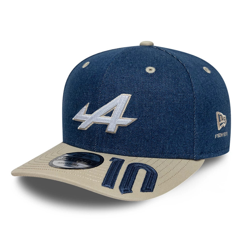 Alpine Racing Austin Race Special Pierre Gasly Navy New Era 9SEVENTY Stretch Snap Adjustable Cap, three-quarter view showing the raised white embroidered A logo on the front panel, a beige visor with navy 10 embroidery and a 9SEVENTY size sticker.