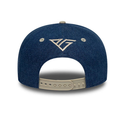 Alpine Racing Austin Race Special Pierre Gasly Navy New Era 9SEVENTY Stretch Snap Adjustable Cap, rear view showing the white embroidered A logo at the centre above the curved opening, with two beige eyelets and a beige snap closure.