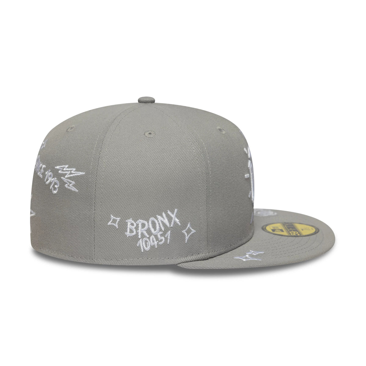 New York Yankees MLB Scribble Grey New Era 59FIFTY Fitted Cap, side view showing white embroidered Bronx 10451 lettering and graphics on the structured grey crown, with a matching grey flat visor and a gold 59FIFTY size sticker on the visor.