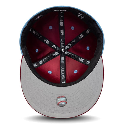 Pictured is this MLB Multi Logo Philadelphia Phillies 59FIFTY Fitted cap in pastel blue. 2