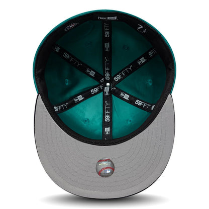 Pictured is this MLB Multi Logo Seattle Mariners 59FIFTY Fitted cap in green. 2