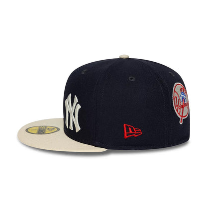 Pictured is this MLB Multi Logo New York Yankees 59FIFTY Fitted cap in navy. 7