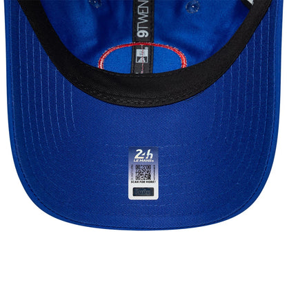 24HR Le Mans Track Blue New Era 9TWENTY Adjustable Cap, inside view showing a black sweatband, red-lined seam tape with white 9TWENTY branding, and a silver-grey 24H Le Mans sticker centrally placed on the blue undervisor.
