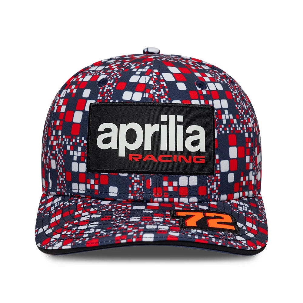 Aprilia Replica Marco Bezzecchi Silverstone Race Special Blue New Era 9SEVENTY Stretch Snap Adjustable Cap, front view showing a large rectangular aprilia racing patch on the centre of the multicoloured patterned crown.