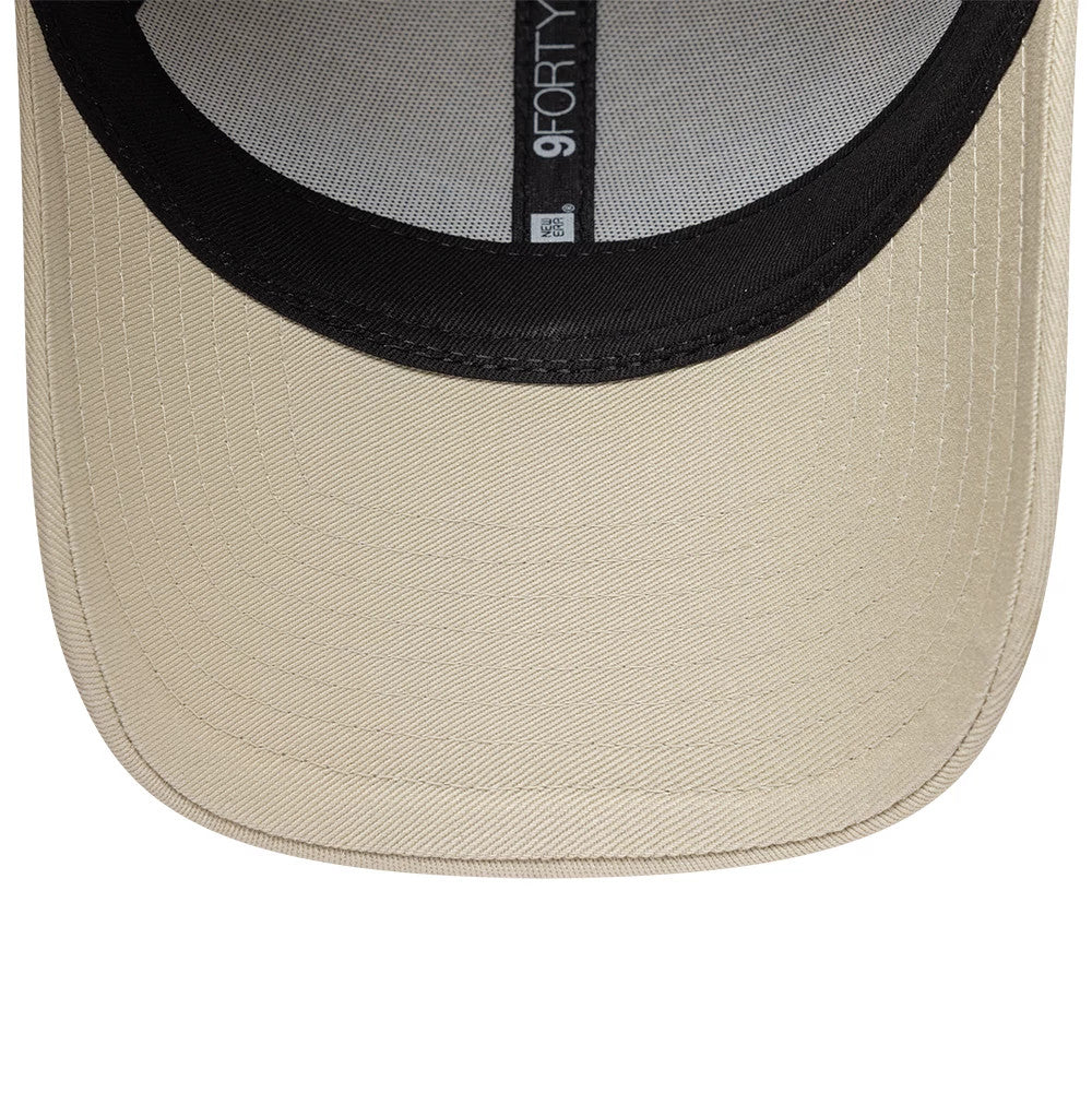Colucci X New Era Light Beige 9FORTY Adjustable Cap, inside view showing a light beige visor with detailed stitching, a contrasting black undervisor, and a black sweatband with 9FORTY labelling.