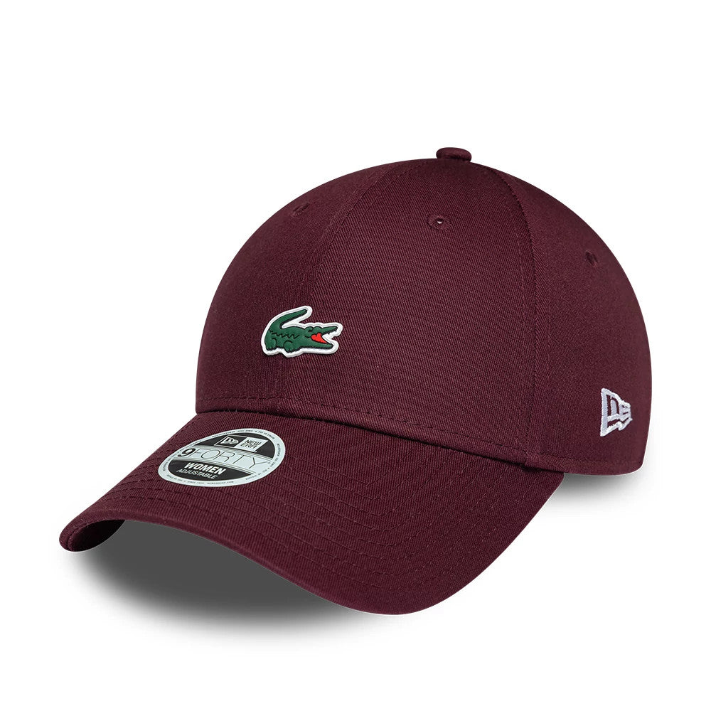 Pictured is this Womens Lacoste X New Era 9FORTY cap in dark purple. 1