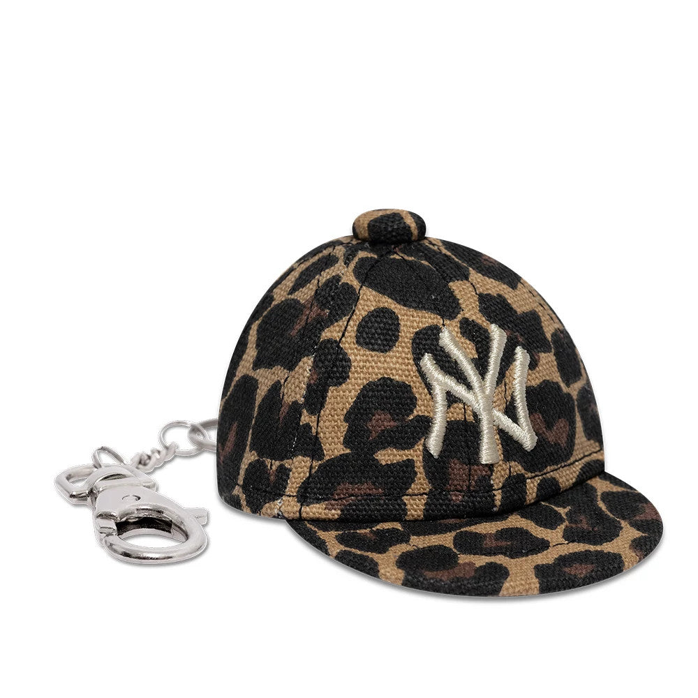 Pictured is this MLB Leo Mini Cap New York Yankees Key Chain in black. 3