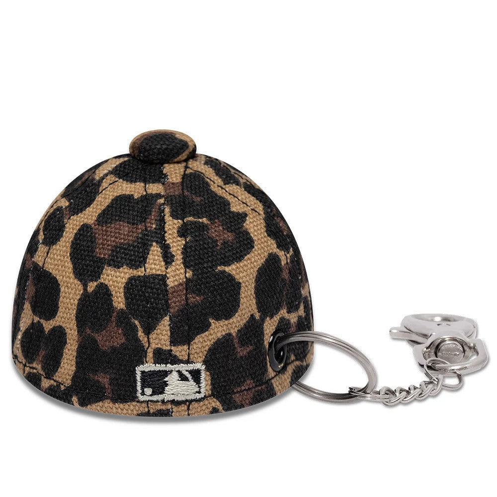 Pictured is this MLB Leo Mini Cap New York Yankees Key Chain in black. 4