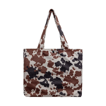 Pictured is this MLB New York Yankees Tote Bag in cow print. 4