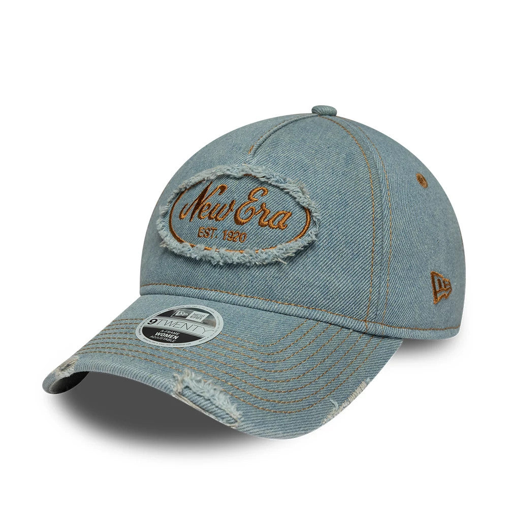 Womens New Era Distress Pastel Blue 9TWENTY A-Frame Adjustable Cap, front three-quarter view showing the brown embroidered New Era graphic centred on the frayed oval patch, distressed on the visor, and New Era flag logo on the left side.