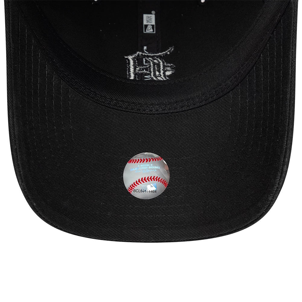 Detroit Tigers MLB Washed Midi Logo Black New Era 9TWENTY Adjustable Cap, inside view showing black sweatband and taping along the crown, large white script lettering on the undervisor, and a round baseball sticker with red stitching beneath.