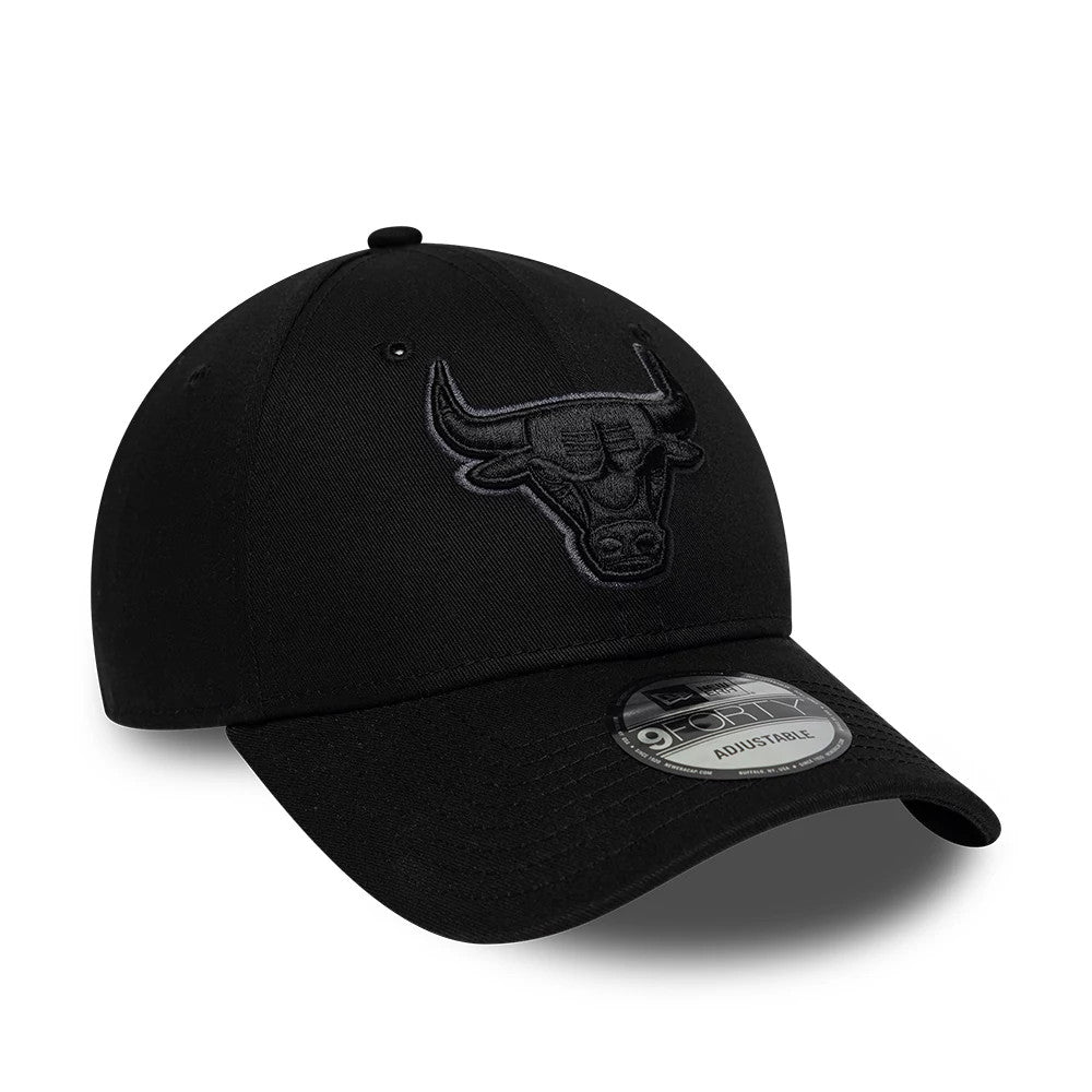 Chicago Bulls NBA Team Outline Black New Era 9FORTY Adjustable Cap, three-quarter view showing the raised black Bulls logo embroidered on the front panel, curved black visor with a 9FORTY size sticker, and eyelets on the structured crown.