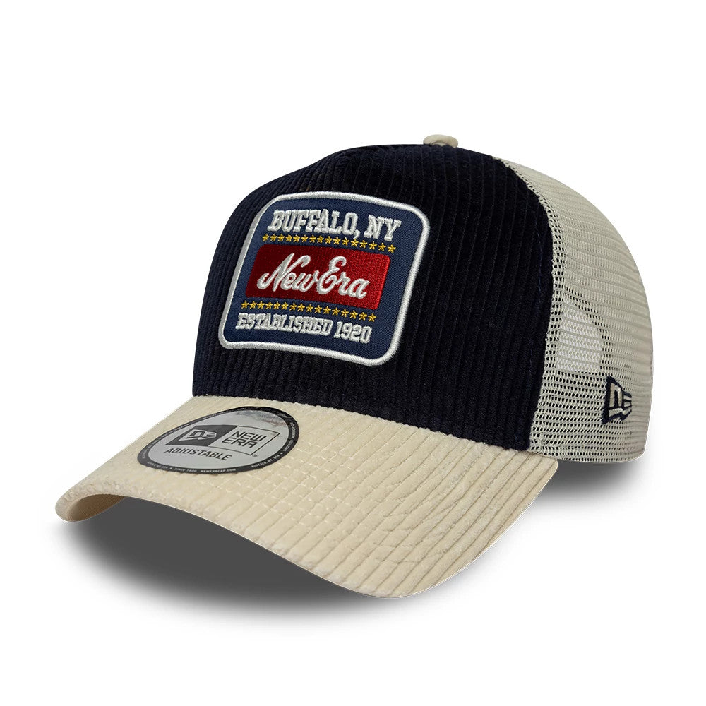 Pictured is this New Era Cord Visor 9FORTY E-Frame Trucker cap in navy. 1