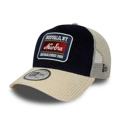 Pictured is this New Era Cord Visor 9FORTY E-Frame Trucker cap in navy. 1
