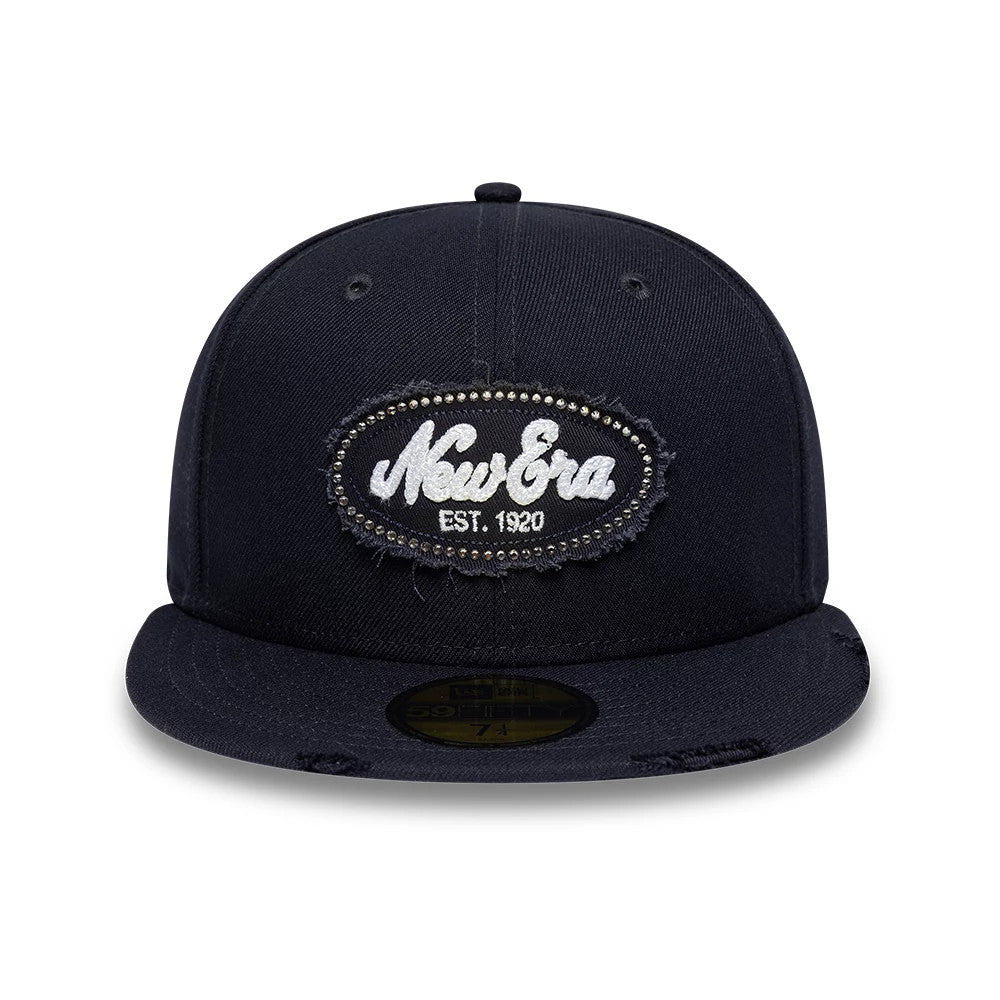 Pictured is this New Era Gem Patch Distress 59FIFTY Fitted cap in navy. 2