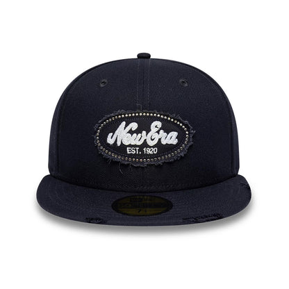 Pictured is this New Era Gem Patch Distress 59FIFTY Fitted cap in navy. 2