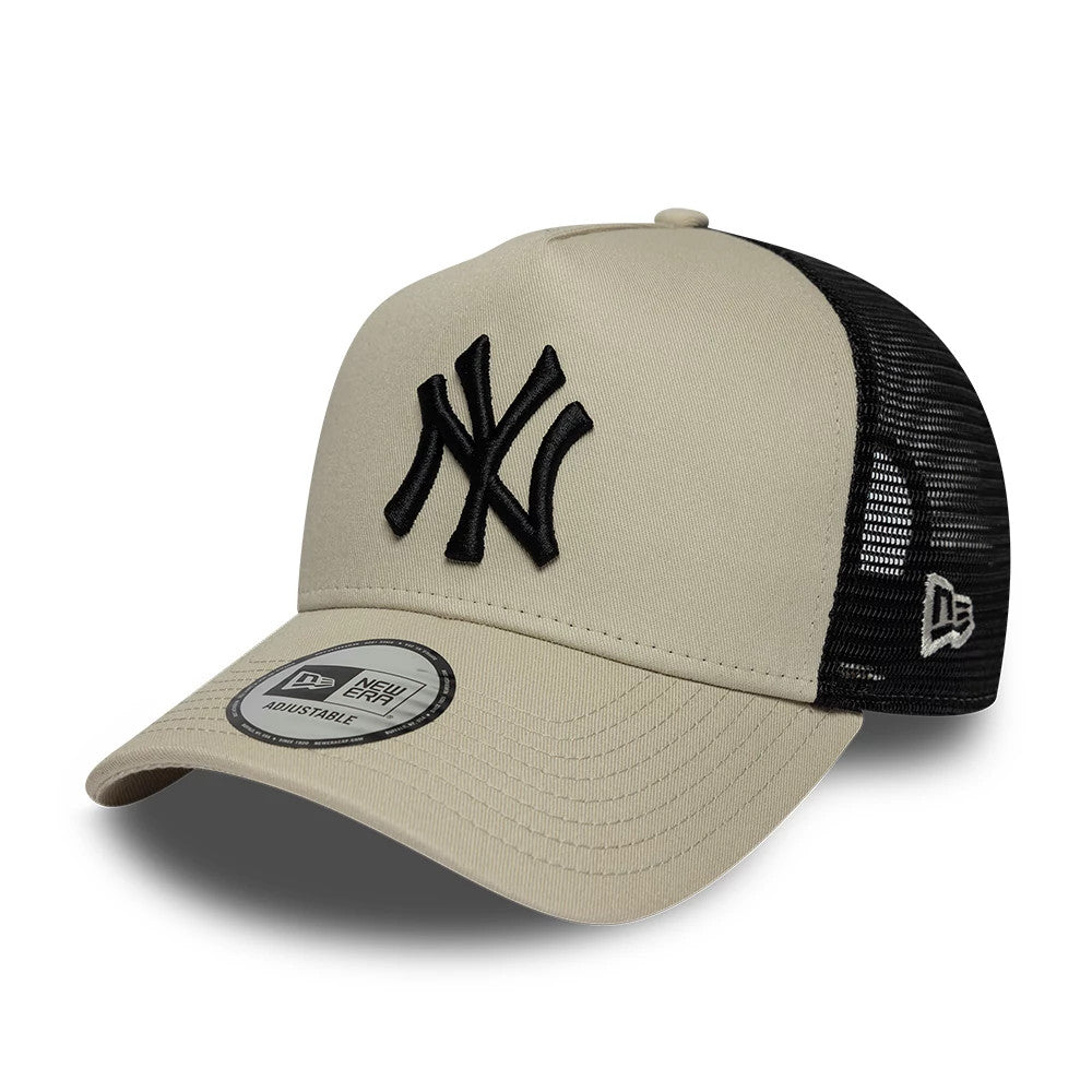 Yankees MLB League Essential Beige New Era 9FORTY A-Frame Trucker Adjustable Cap, front view showing the black raised embroidered NY logo on the beige structured front panel, with black mesh rear panels and a 9FORTY size sticker on the curved visor.