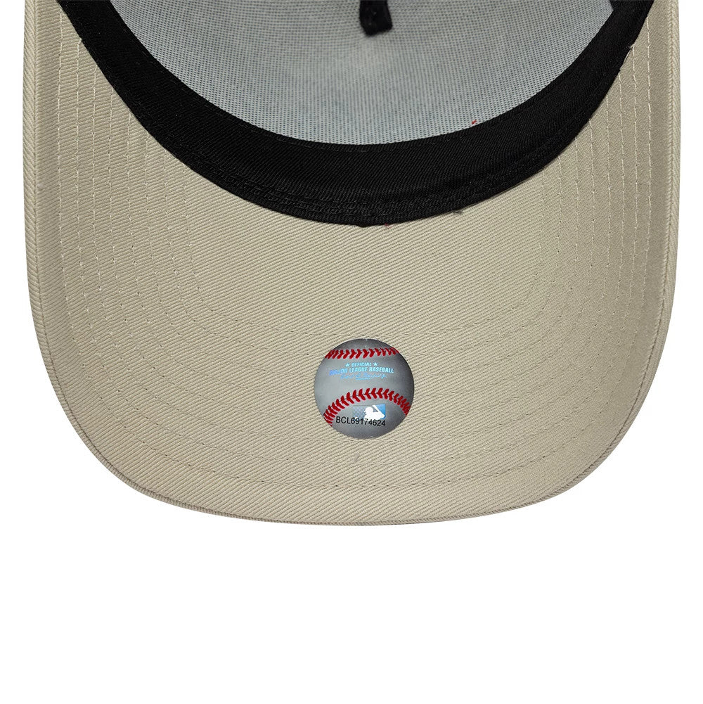 Pictured is this MLB League Essential New York Yankees 9FORTY A-Frame Trucker cap in light beige. 5