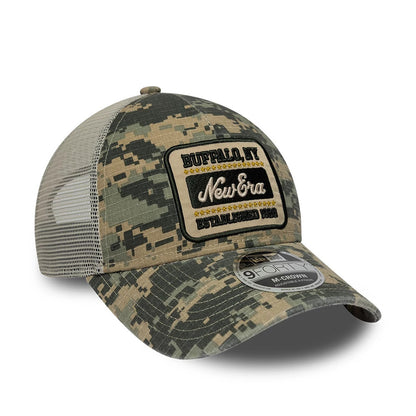 Pictured is this New Era Camo 9FORTY M-Crown A-Frame Trucker cap in woodland camo. 3