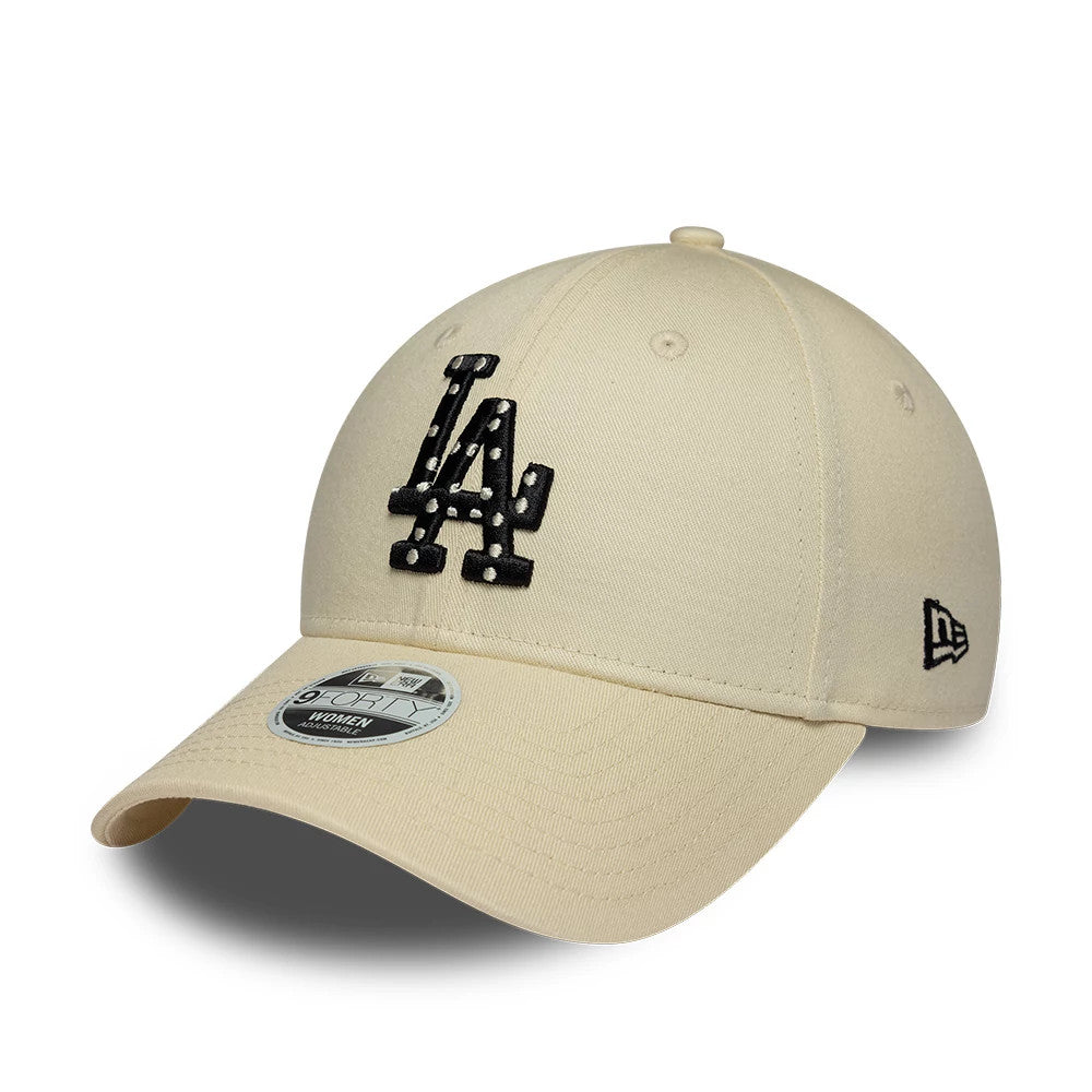 LA Dodgers Womens MLB Infill Light Beige New Era 9FORTY Adjustable Cap, three-quarter view showing a black infill LA logo with stitching details on the front panel, light beige curved visor, and New Era flag logo embroidered on the left side.