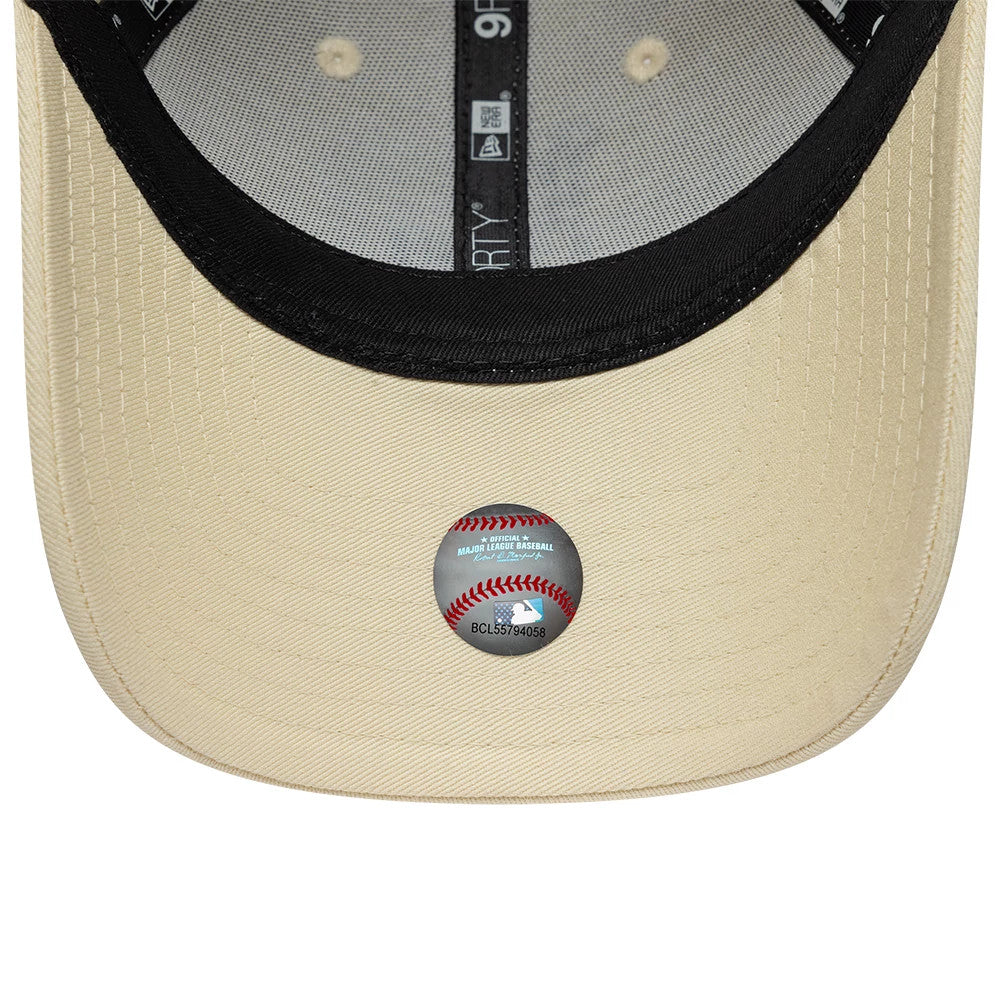 LA Dodgers Womens MLB Infill Light Beige New Era 9FORTY Adjustable Cap, inside view showing the black sweatband, grey taping with 9FORTY branding, and a black undervisor with a MLB authentication sticker on the curved light beige visor.
