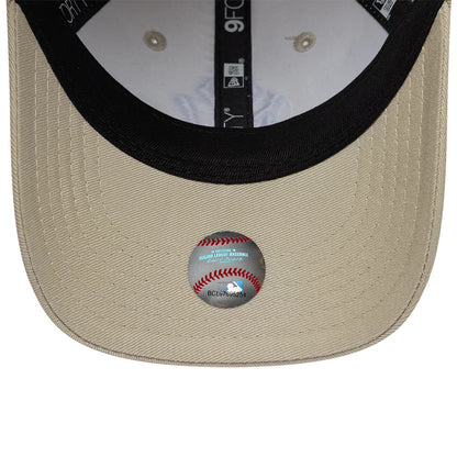 Yankees Toddler MLB Monster Icon Beige New Era 9FORTY Adjustable Cap, inside view showing the black sweatband with 9FORTY taping, beige undervisor with a baseball sticker, and the white interior featuring embroidered eyelets.