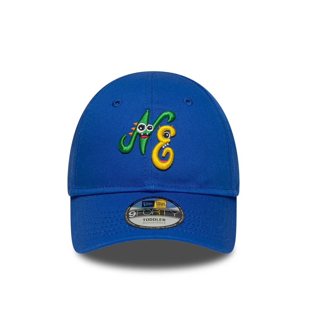 Toddler New Era Monster Icon Blue 9FORTY Adjustable Cap, front view showing cartoon-style NE embroidery with playful eyes and colours, including green and yellow threads, on the structured blue crown.