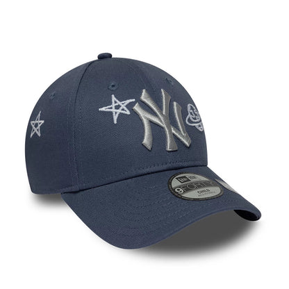 Yankees Child MLB Space Glow In The Dark Blue New Era 9FORTY Adjustable Cap, three-quarter view showing grey raised embroidered NY logo on the front panel with star and planet designs, a structured blue crown.